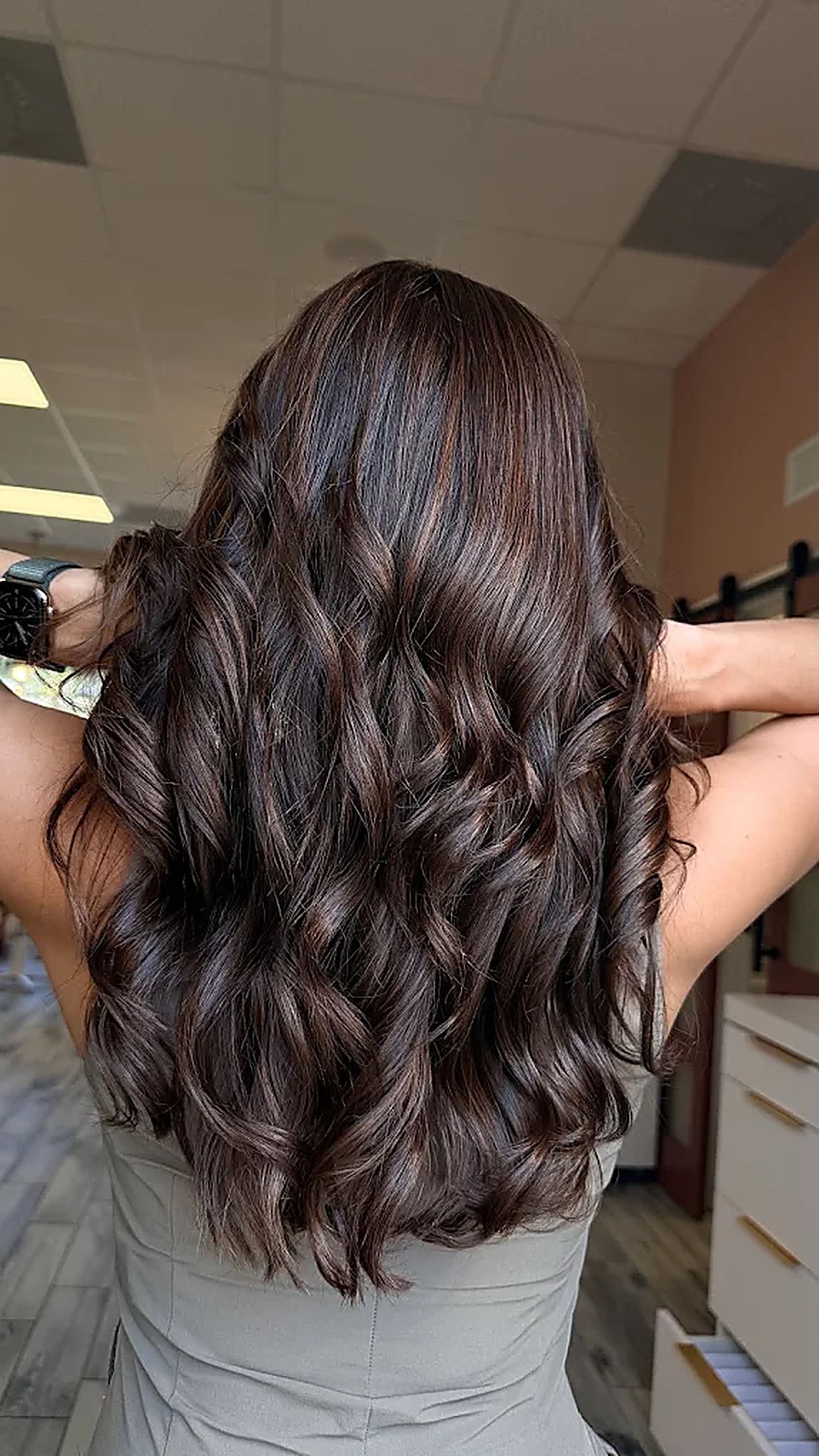 Long, voluminous dark waves created with The Celina Collection extensions